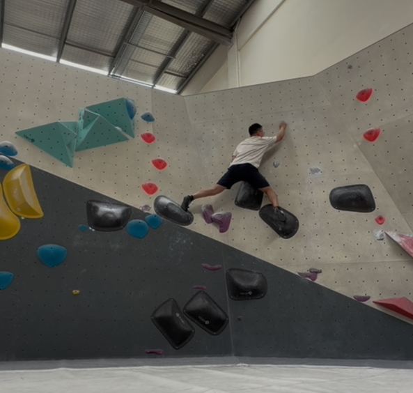 Client on climbing wall